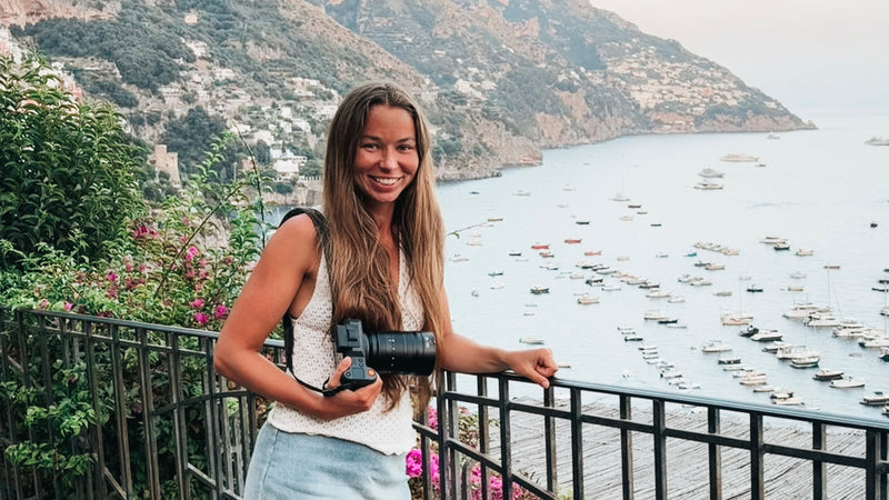 Grace Hinchen in Positano, Italy holding a Hasselblad X2D 100C II 